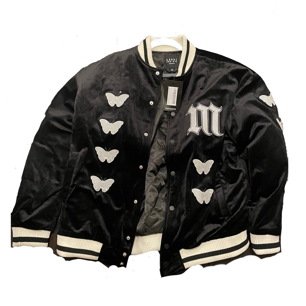 Black & white “varsity jacket” with letter M and butterflies